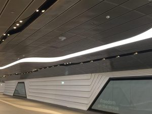 Wynyard to Barangaroo walkway tunnel featuring perforated metal panels by Arrow Metal