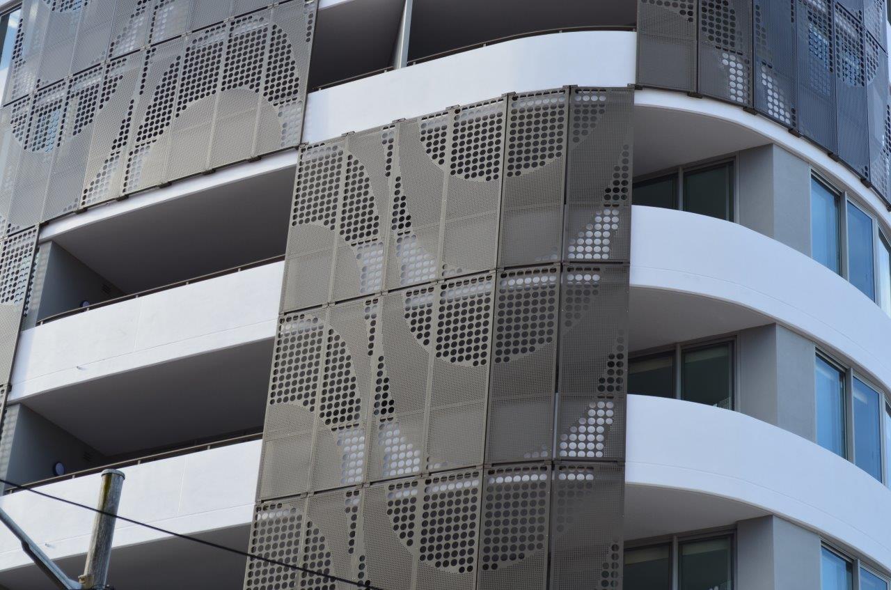 Round hole perforated metal facade by Arrow Metal